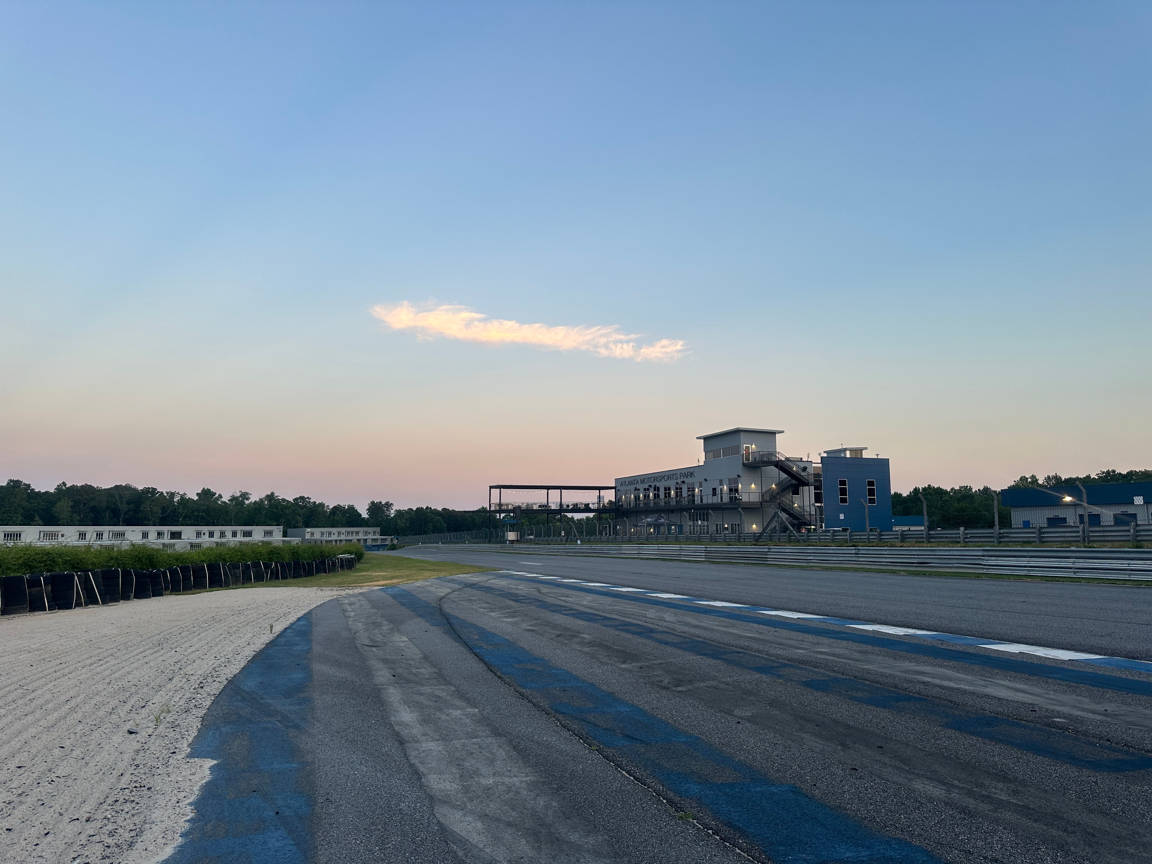 The front stretch at Atlanta Motorsports Park photographed at dusk